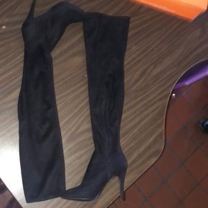 Black thigh high heeled boots